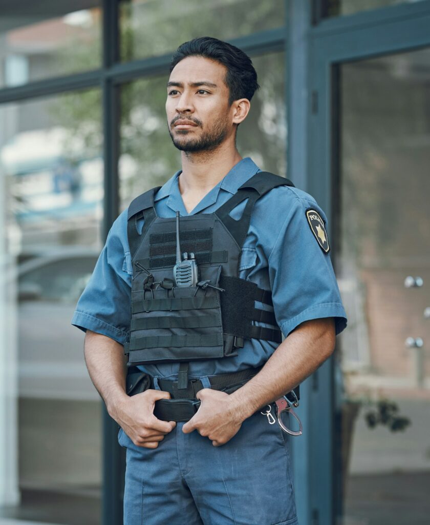 Security, police officer and man in uniform in city for defense, inspection and supervision on patr